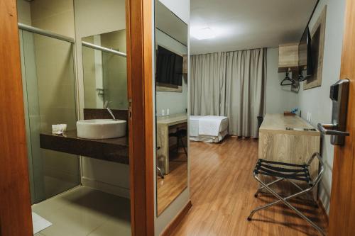 Catuai Hotel Cacoalにあるベッド