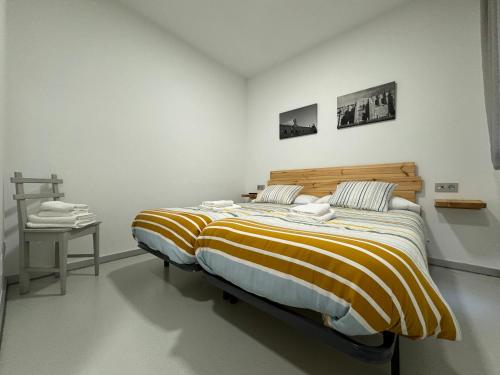 Posteľ alebo postele v izbe v ubytovaní Apartamentos Mk77 León- San Isidoro