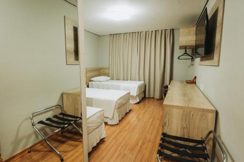 Catuai Hotel Cacoalにあるベッド