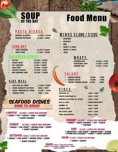 a menu for a food menu on a wall at Ocean Blue Villa in Lucea in Point