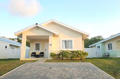 a house with a patio in front of it at Ocean Blue Villa in Lucea in Point