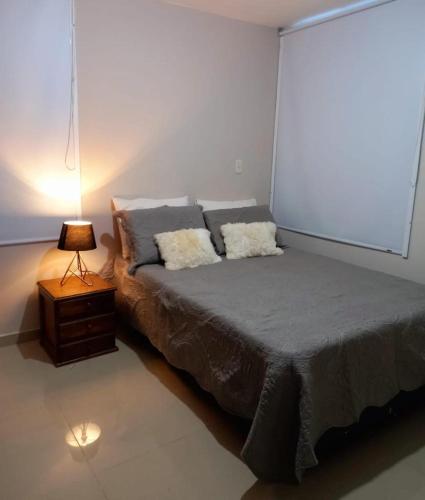 מיטה או מיטות בחדר ב-Apartamento Mirador de la sierra II