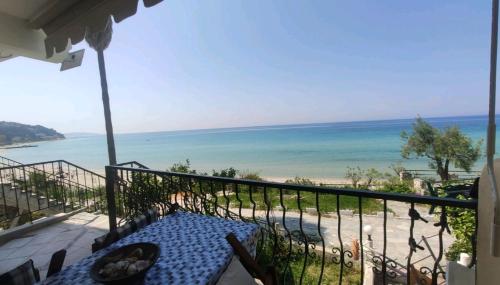 a balcony with a view of the ocean at Blue Beach Siviri Chalkidiki in Siviri