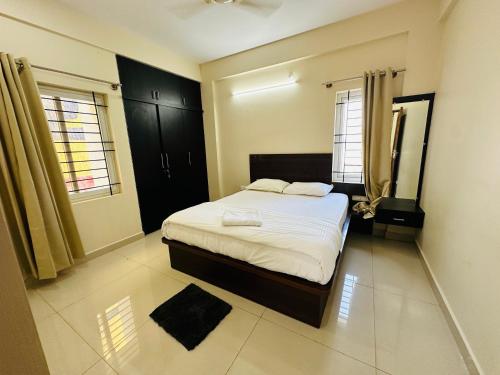 Postel nebo postele na pokoji v ubytování Oryx Residences - Luxury Serviced Apartments
