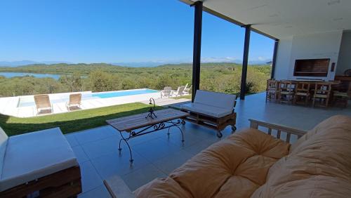 a living room with a couch and a table at Casa Paradiso in Coronel Moldes