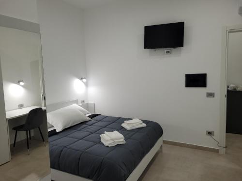 Postel nebo postele na pokoji v ubytování Gemini rooms
