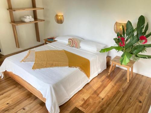 Postel nebo postele na pokoji v ubytování Casa Yami Lodge