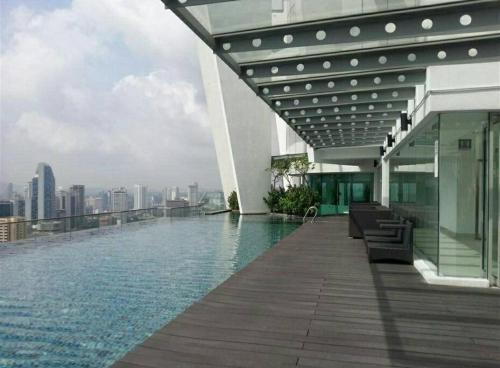 a swimming pool on the roof of a building at Cozy 2BR*Infinity Pool @ Regalia by baitul sakinah in Kuala Lumpur