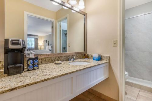 a bathroom with a sink and a mirror at Best Western PLUS Santee Inn in Santee
