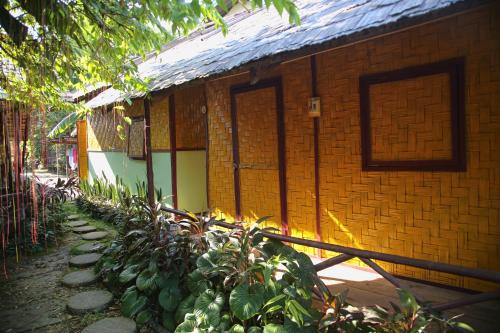 a building with a door on the side of it at Pan's Place in Vang Vieng