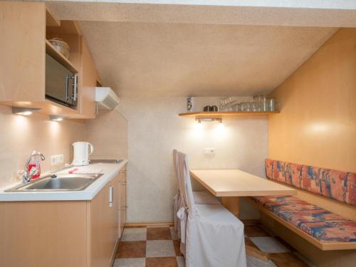 a small kitchen with a sink and a counter at Vanessa in Zell am See