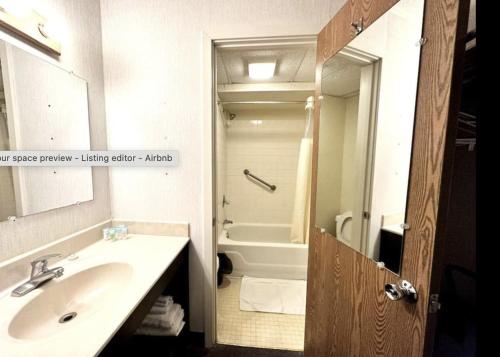a bathroom with a sink and a bath tub at Kiteville Phoenixville in Phoenixville