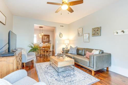 a living room with a couch and a tv at Furnished Patio and Yard Denver Bungalow! in Denver