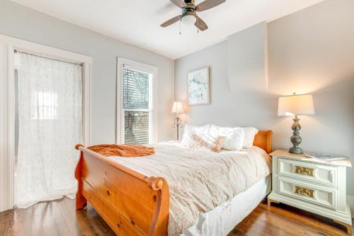 a bedroom with a bed and a ceiling fan at Furnished Patio and Yard Denver Bungalow! in Denver
