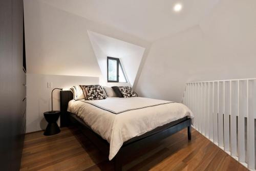 a bedroom with a bed in a attic at New York style Loft in Sydney