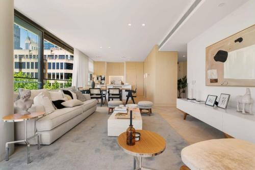 a living room with a couch and a table at Terrace Boutique in the Heart of The Rocks in Sydney