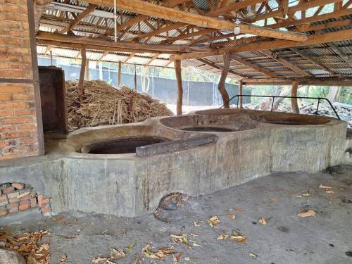 a large stone structure in a brick building at Casa de las Brujas Escazú in Escazu