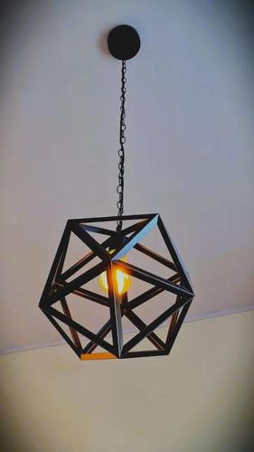 a chandelier is hanging from a ceiling at Casa de las Brujas Escazú in Escazu
