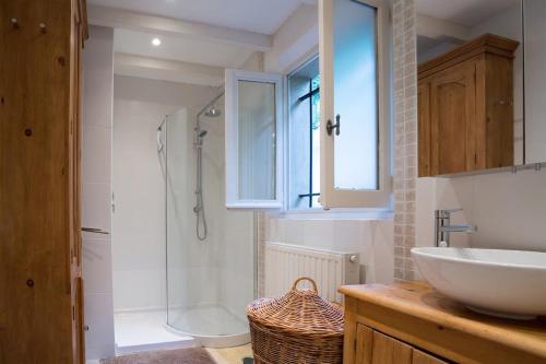 a bathroom with a sink and a toilet and a shower at Luxury 3 bedroom villa with pool in Spéracèdes