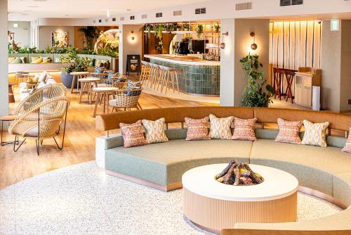 a living room with a couch and a table at Keio Plaza Hotel Tokyo in Tokyo