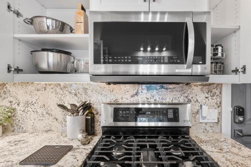 a kitchen with a stove and a microwave at Tahoe Bliss: Ski, Hike, & Relax in Incline Village