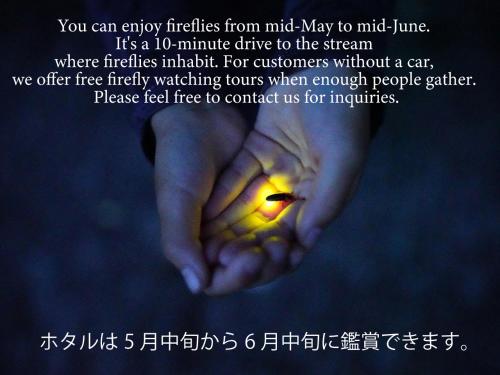 a picture of a hand with a candle in it at Villa Yumigahama in Minamiizu