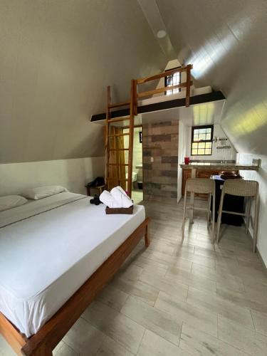 a bedroom with a bunk bed and a desk at Cabañas La Encantada 