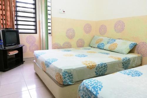 Tempat tidur dalam kamar di Kampung Homestay, Kuantan