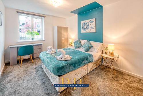 a bedroom with a bed and a desk and a window at The Sale Symphony Suite - By Parydise Properties - Business or Leisure Stays - Sleeps 6 - Sale, Manchester in Sale