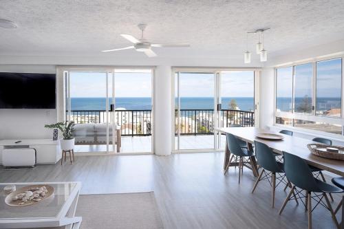 a living room with a view of the ocean at Kings Beach Coast and Glasshouse Views - A in Caloundra