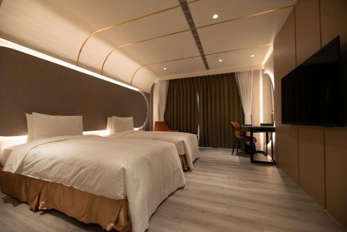 Ένα ή περισσότερα κρεβάτια σε δωμάτιο στο Jingying Qinlu Hotel