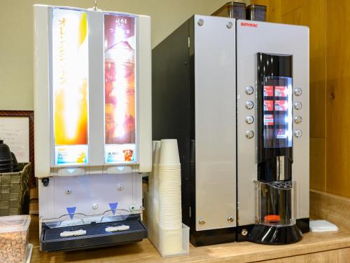 a coffee machine sitting on top of a counter at Hotel Econo Fukui Station in Fukui