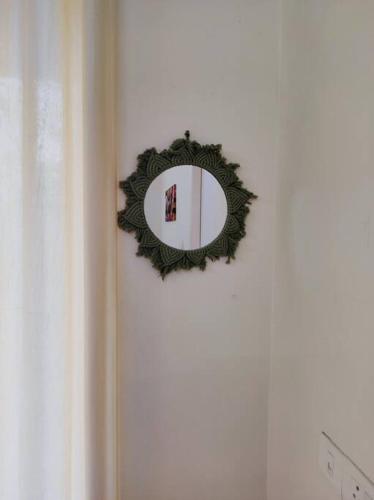 a mirror on a wall next to a door at Flat in Kochi (302) in Cochin