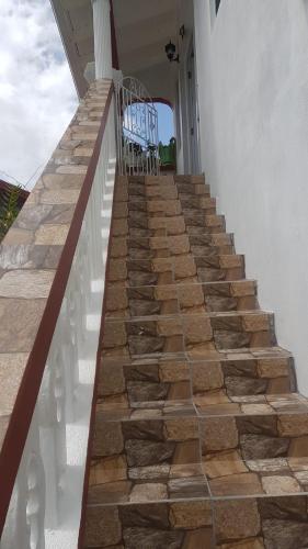 a set of stone stairs on a house at Rohan and Shelly's Inn in Castries
