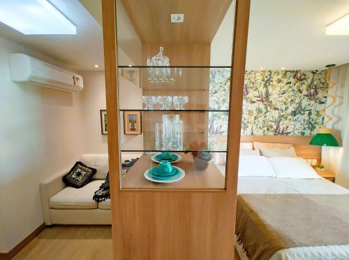 Ένα ή περισσότερα κρεβάτια σε δωμάτιο στο FLAT VARANDA PEDRA AZUL - Vista Azul Apart Hotel