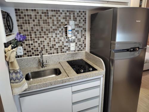 Η κουζίνα ή μικρή κουζίνα στο FLAT VARANDA PEDRA AZUL - Vista Azul Apart Hotel
