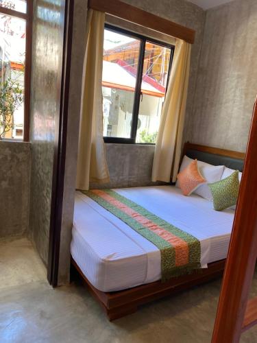 Кровать или кровати в номере RL HARBOR INN ANNEX