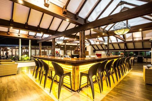 a bar with chairs lined up at a restaurant at Iririki Island Resort & Spa in Port Vila