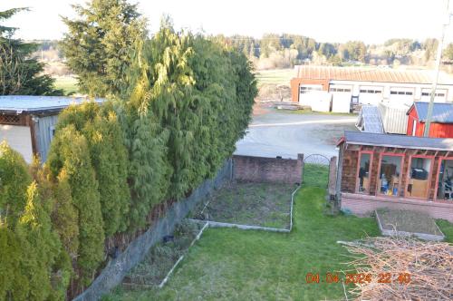 an image of a yard with a retaining wall at Estuary House Reflexology B&B in Courtenay