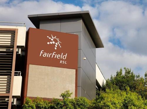 a building with a sign in front of it at Aircabin - Fairfield - Modern - 6 Bedrooms House in Fairfield