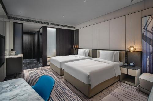 Katil atau katil-katil dalam bilik di Crowne Plaza Ezhou by IHG