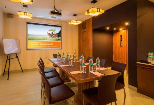 a conference room with a long table and chairs at Home@F37 Kailash Colony Metro in New Delhi