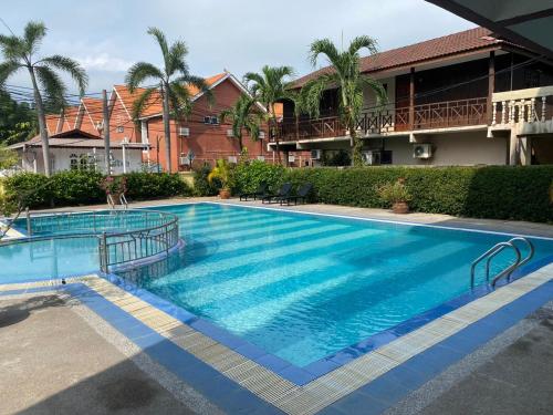 a large blue swimming pool in front of a building at Pangkor Bay View Beach Resort in Pangkor
