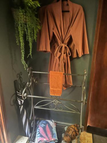 a robe hanging on a rack in a room at Whitsundays BNB Retreat in Airlie Beach