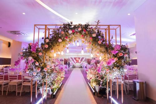 a wedding altar with flowers and chairs in a room at Go Hotels Iligan in Iligan City