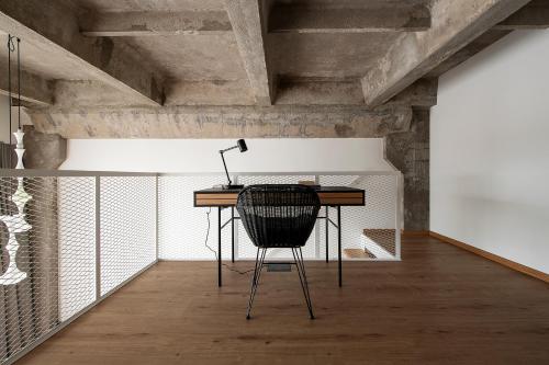 a desk with a lamp on it in a room at Super stylish loft in Tallinn