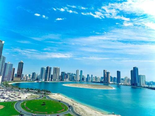 a view of a city with a beach and buildings at lagoon view-Entire apartment in Sharjah