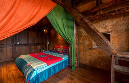 a bedroom with a bed with a canopy at Khói Panorama in Dồng Văn