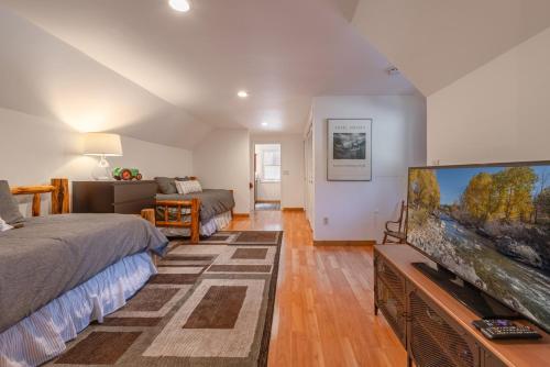 a living room with a large flat screen tv at Cozy Cabin 5 Min Walk to Lake Tahoe Hot-Tub Excellent Location in Tahoe Vista