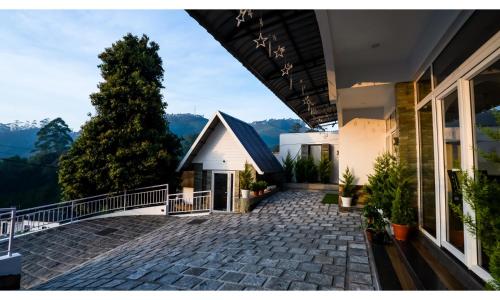 a view from the balcony of a house at Carmel Top Munnar in Munnar